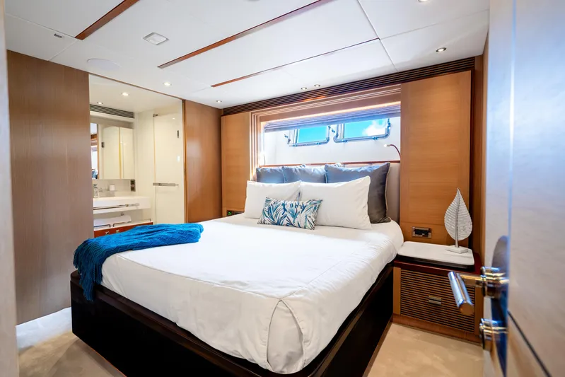 One More Time Yacht Photos Pics Luxurious bedroom interior on 2020 Horizon FD80 yacht with modern design and elegant decor.