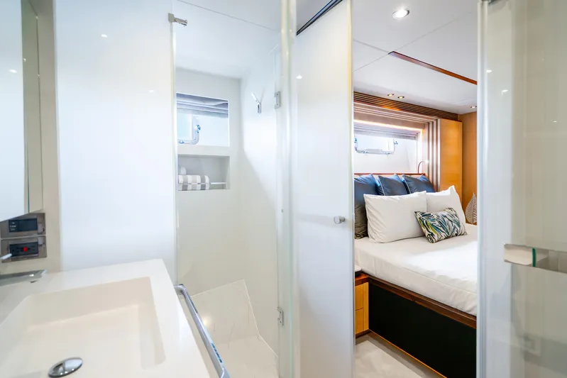 One More Time Yacht Photos Pics Luxurious Horizon FD80 yacht interior, featuring a modern bedroom and bathroom, 2020 model.