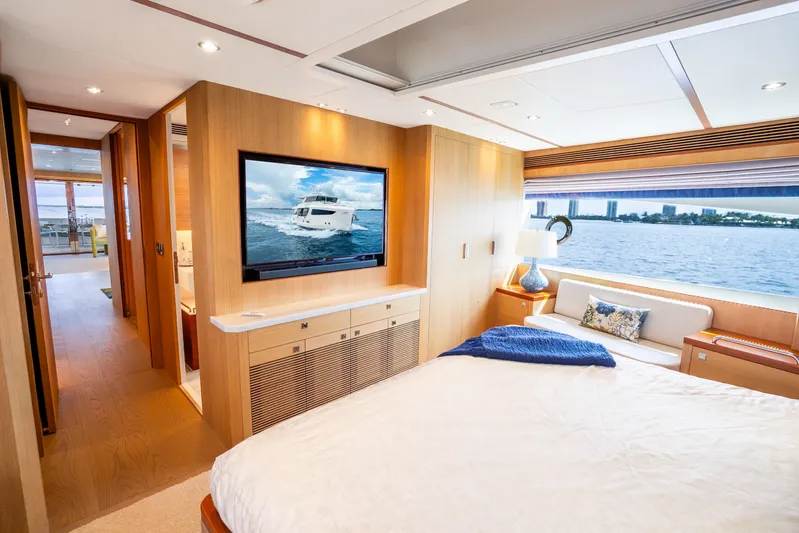One More Time Yacht Photos Pics Luxurious Horizon FD80 yacht bedroom with waterfront view, modern decor, and large TV, 2020 model.