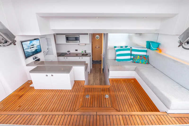 One More Time Yacht Photos Pics Luxurious Horizon FD80 yacht interior with modern kitchen, cozy seating, and stylish decor, 2020 model.