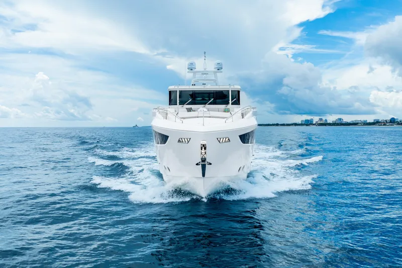 One More Time Yacht Photos Pics Luxurious 2020 Horizon FD80 yacht cruising on open sea under blue sky.