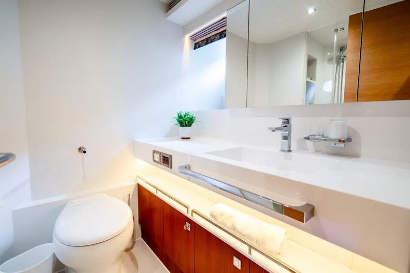 One More Time Yacht Photos Pics Modern bathroom in 2020 Horizon FD80 yacht with sleek fixtures and elegant design.