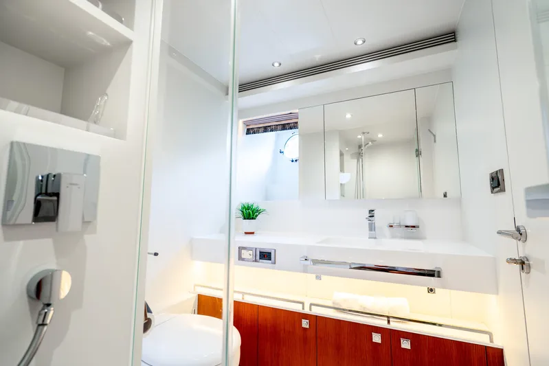 One More Time Yacht Photos Pics Luxurious bathroom interior on 2020 Horizon FD80 yacht, featuring modern fixtures and elegant design.