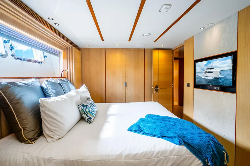 One More Time Yacht Photos Pics Luxurious bedroom in 2020 Horizon FD80 yacht with modern decor and ocean view.