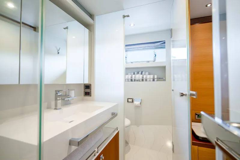 One More Time Yacht Photos Pics Modern bathroom interior on 2020 Horizon FD80 yacht, featuring sleek design and amenities.