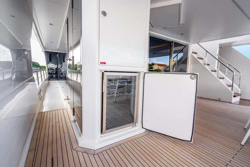 One More Time Yacht Photos Pics Luxurious Horizon FD80 yacht deck with open fridge, sleek design, and modern amenities, 2020 model.