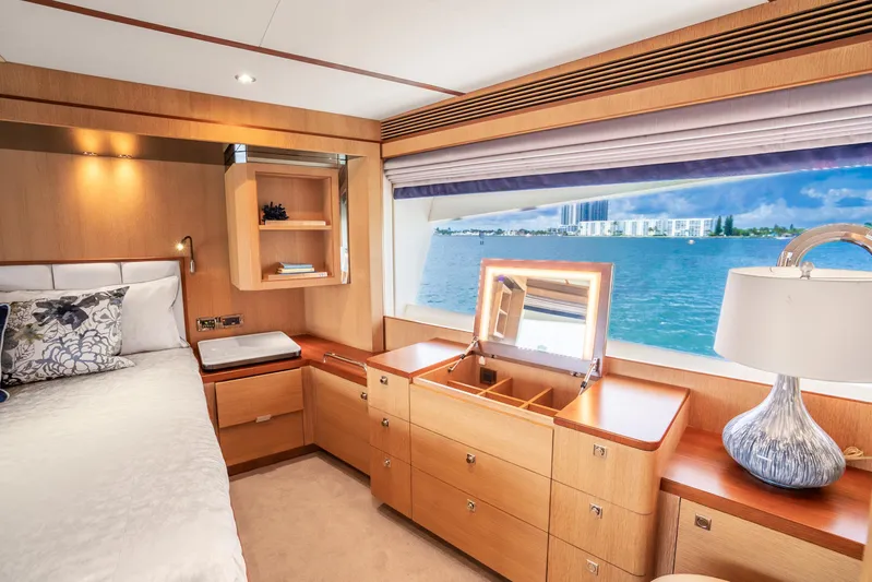 One More Time Yacht Photos Pics Luxurious Horizon FD80 yacht bedroom with ocean view, elegant wood furnishings, and modern decor.