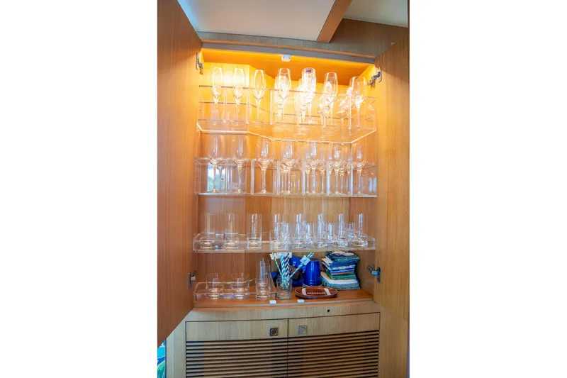 One More Time Yacht Photos Pics Luxurious glassware cabinet on Horizon FD80 yacht, 2020 model, with neatly arranged glasses.