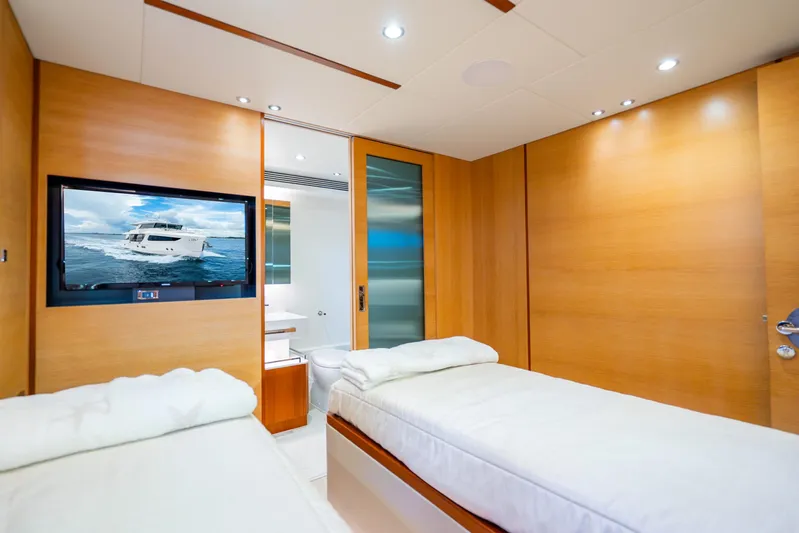 One More Time Yacht Photos Pics Luxurious 2020 Horizon FD80 yacht cabin with twin beds and modern amenities.