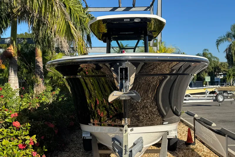  Yacht Photos Pics 2021 Blackfin 272 CC boat in a tropical setting with palm trees.