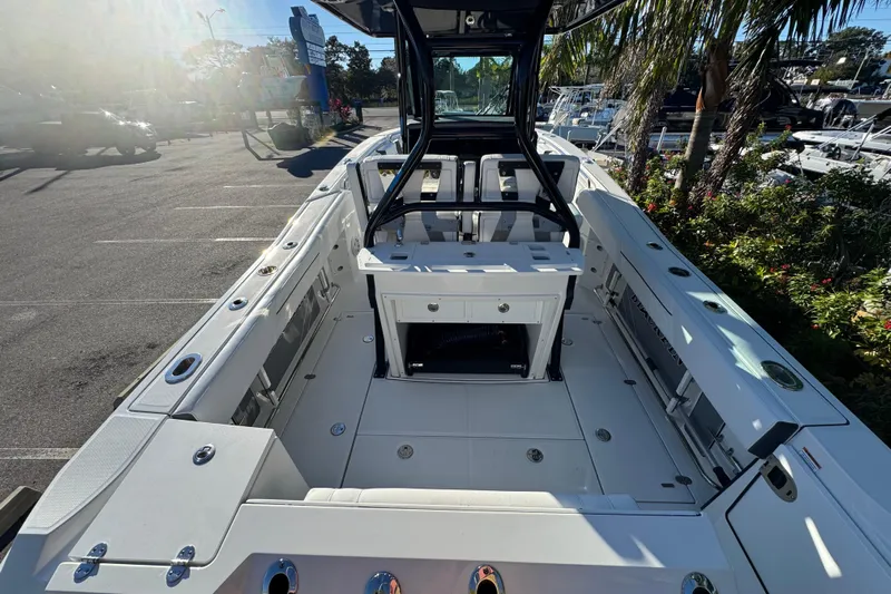  Yacht Photos Pics 2021 Blackfin 272 CC boat interior with spacious deck and seating in a sunny marina.