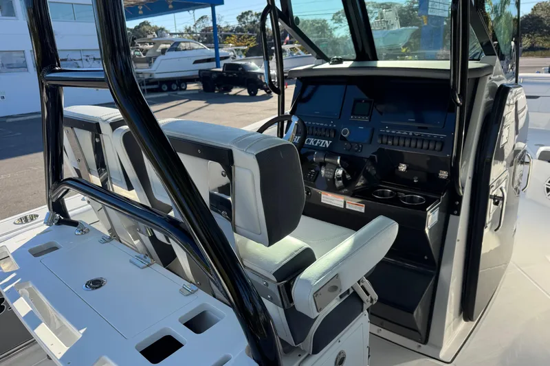  Yacht Photos Pics 2021 Blackfin 272 CC boat interior with helm, seating, and control panel.
