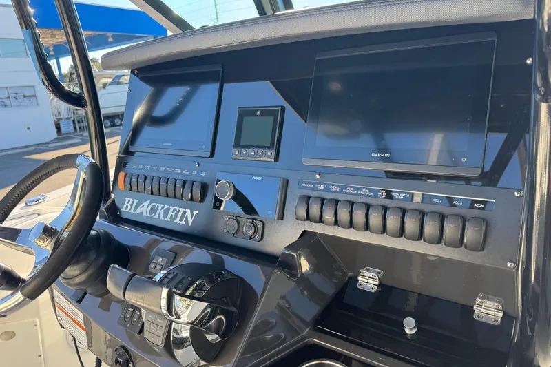  Yacht Photos Pics 2021 Blackfin 272 CC boat dashboard with Garmin displays and control switches.