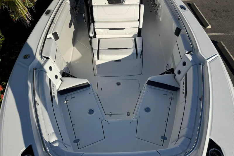  Yacht Photos Pics 2021 Blackfin 272 CC boat interior with seating and storage compartments.