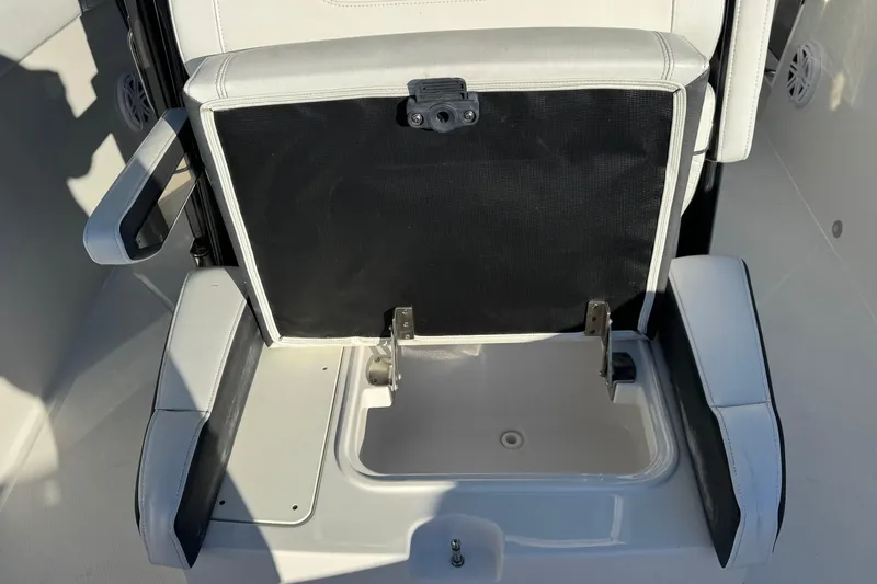  Yacht Photos Pics 2021 Blackfin 272 CC boat seat with storage compartment open.