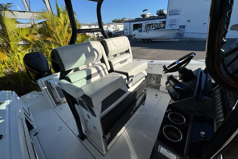  Yacht Photos Pics 2021 Blackfin 272 CC boat interior with dual seats and steering console.