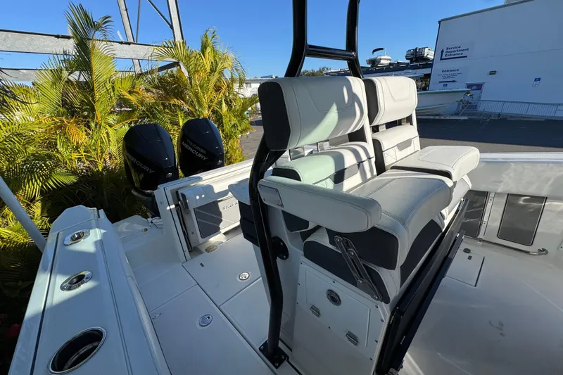  Yacht Photos Pics 2021 Blackfin 272 CC boat interior with dual Mercury engines and cushioned seating.