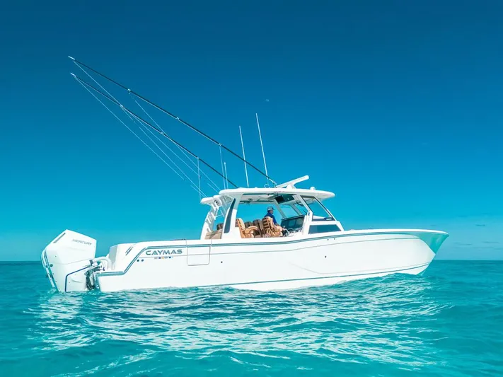  Yacht Photos Pics 2025 Caymas 44 CT boat on clear blue water under a sunny sky.