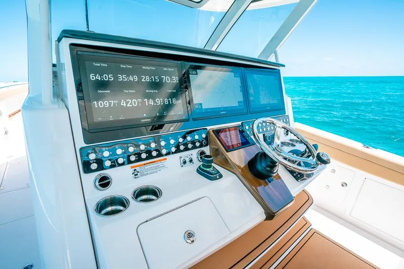  Yacht Photos Pics 2025 Caymas 44 CT boat dashboard with advanced navigation system and steering wheel.