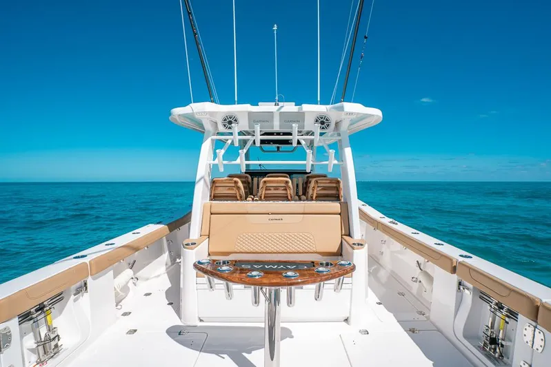  Yacht Photos Pics 2025 Caymas 44 CT boat on open sea with clear blue skies.