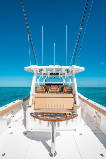  Yacht Photos Pics 2025 Caymas 44 CT boat on clear blue ocean under sunny sky.