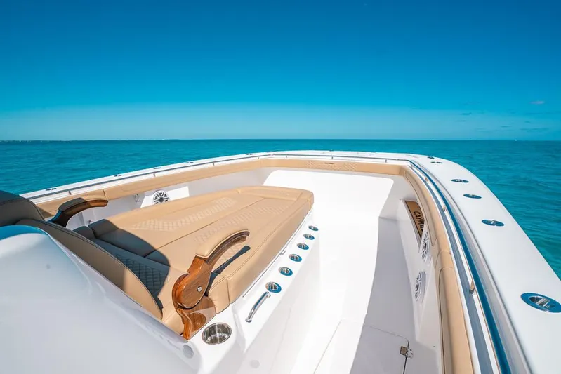  Yacht Photos Pics 2025 Caymas 44 CT boat on open sea under clear blue sky.