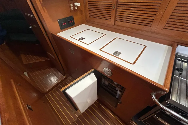  Yacht Photos Pics Interior of 1995 Tayana 48 yacht with wooden cabinetry and built-in appliances.