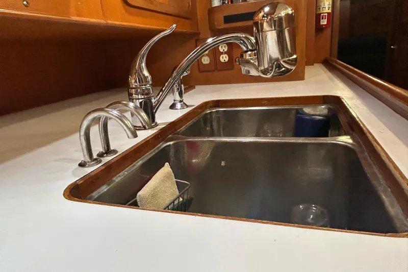  Yacht Photos Pics Stainless steel sink and faucet in 1995 Tayana 48 yacht galley.