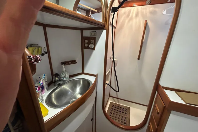  Yacht Photos Pics Bathroom interior of 1995 Tayana 48 yacht with sink and shower.