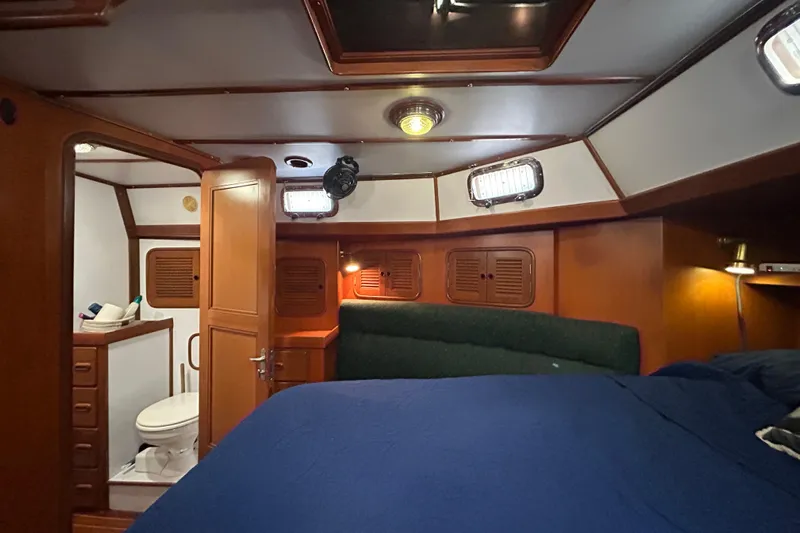  Yacht Photos Pics Interior of 1995 Tayana 48 yacht cabin with bed and bathroom.