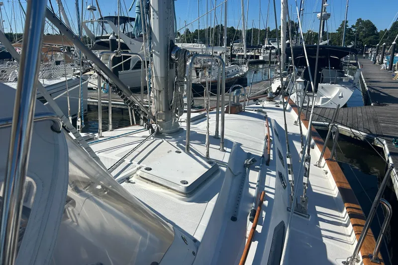  Yacht Photos Pics Sailboat docked at marina, Tayana 48, 1995 model, with visible deck and rigging.