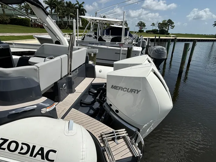  Yacht Photos Pics 2024 Zodiac Medline 9 boat with Mercury engines docked by the water.