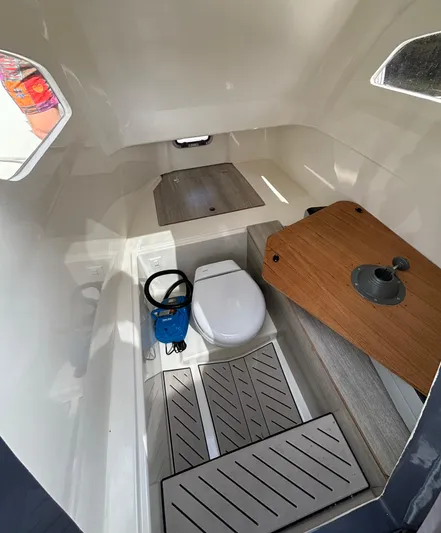  Yacht Photos Pics 2024 Zodiac Medline 9 cabin interior with toilet and wooden table.