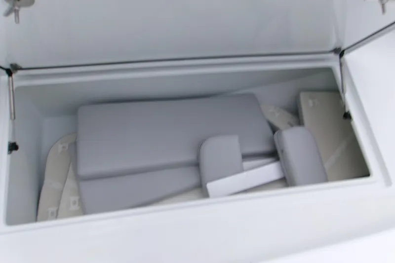  Yacht Photos Pics Storage compartment of 2026 Contender 28 Tournament boat with cushions inside.