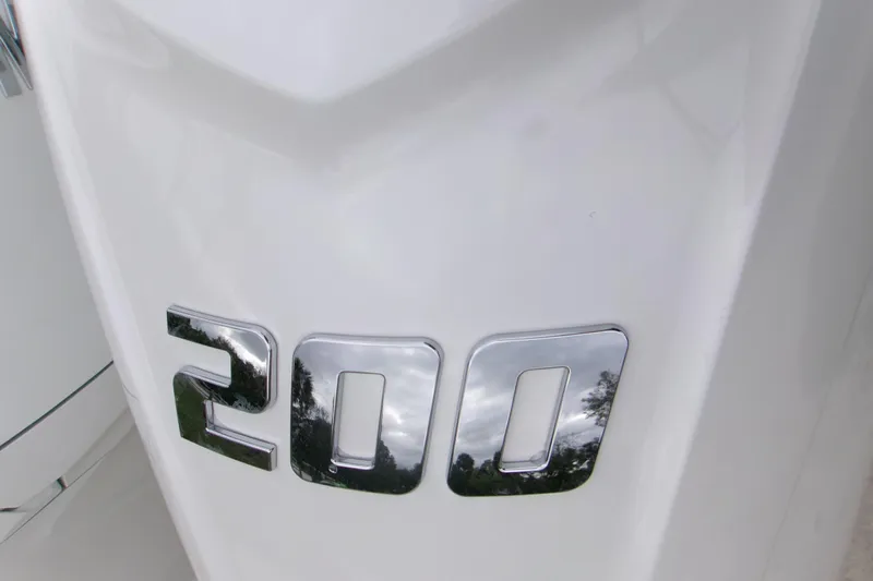  Yacht Photos Pics Close-up of chrome '200' emblem on 2026 Contender 28 Tournament boat.