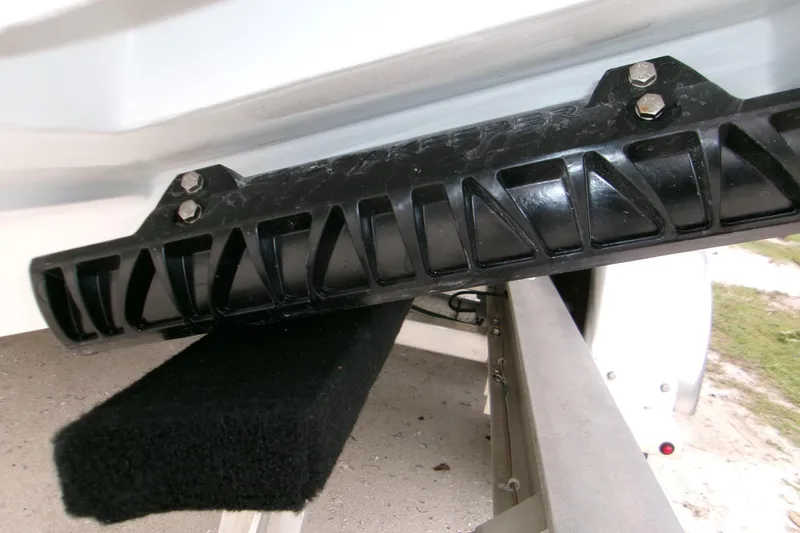  Yacht Photos Pics 2026 Contender 28 Tournament boat trailer detail with black protective guard.