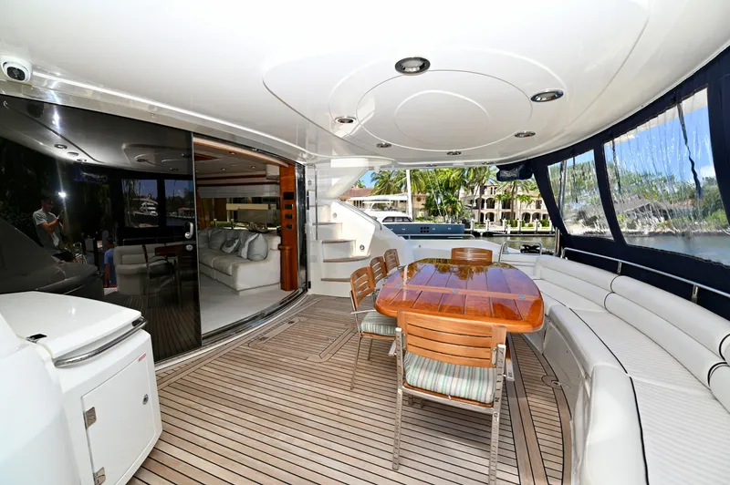 "bella" Yacht Photos Pics Luxurious 2005 Sunseeker 82 Yacht with elegant outdoor seating and dining area.