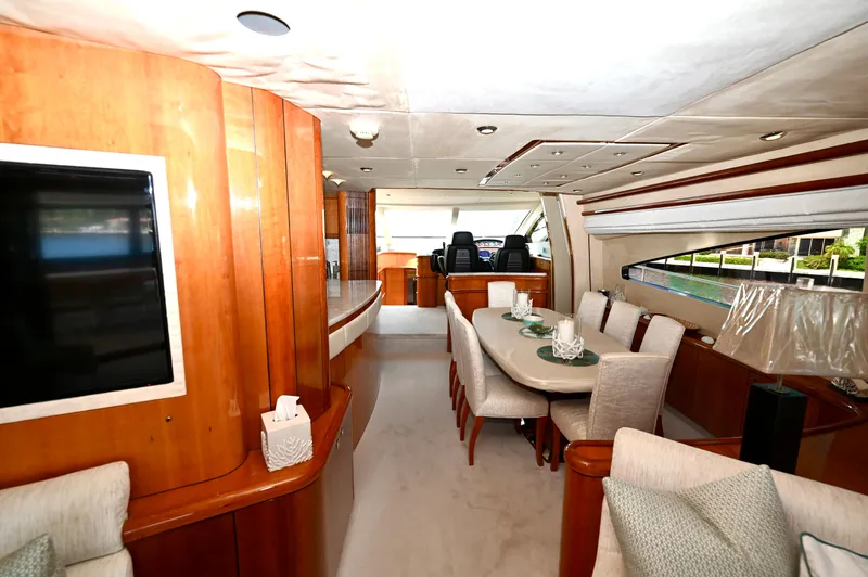 "bella" Yacht Photos Pics Luxurious interior of 2005 Sunseeker 82 Yacht with elegant dining area and modern decor.