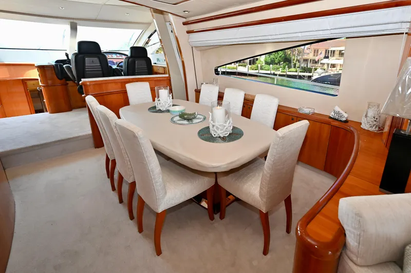 "bella" Yacht Photos Pics Luxurious dining area inside a 2005 Sunseeker 82 Yacht, featuring elegant seating and decor.
