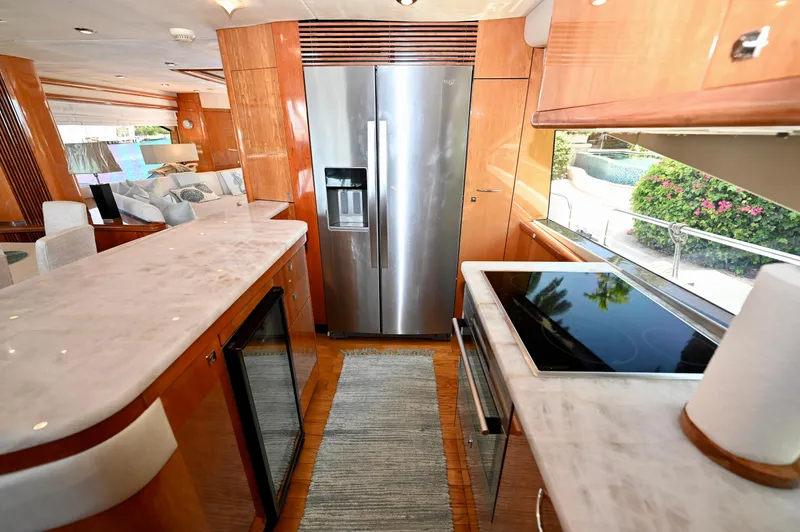 "bella" Yacht Photos Pics Luxurious kitchen interior of 2005 Sunseeker 82 Yacht with modern appliances and elegant design.