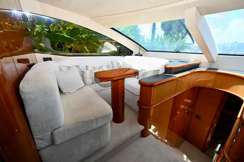 "bella" Yacht Photos Pics Luxurious interior of 2005 Sunseeker 82 Yacht with plush seating and elegant wood finishes.