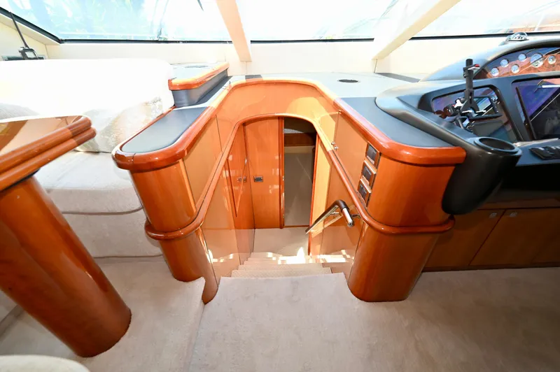 "bella" Yacht Photos Pics Luxurious interior of a 2005 Sunseeker 82 Yacht, featuring polished wood and modern design.