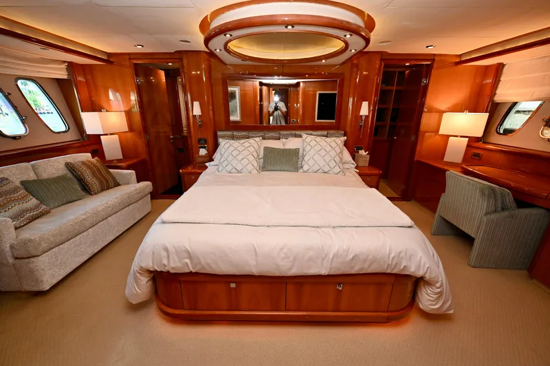"bella" Yacht Photos Pics Luxurious master bedroom on a 2005 Sunseeker 82 Yacht with elegant wood finishes.