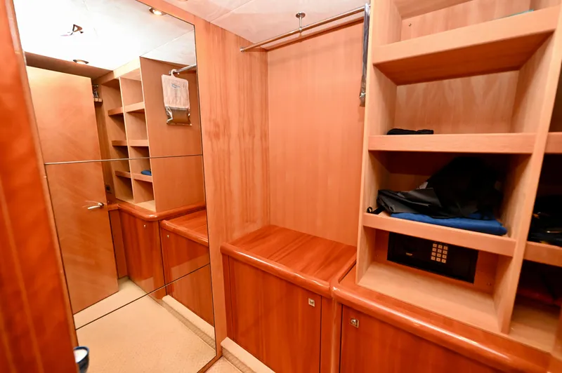 "bella" Yacht Photos Pics Luxurious wooden interior of 2005 Sunseeker 82 Yacht with shelves and mirror.