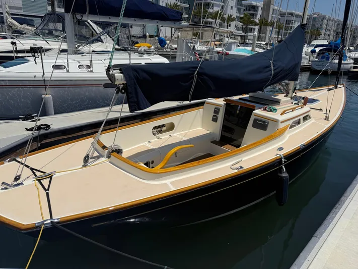 Bolero Yacht Photos Pics Sailboat docked in marina, 2012 Morris M29 model, with covered sails.