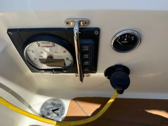Bolero Yacht Photos Pics Control panel of a 2012 Morris M29 boat with fuel gauge and switches.