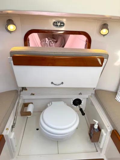 Bolero Yacht Photos Pics Interior of a 2012 Morris M29 boat featuring a compact marine toilet setup.