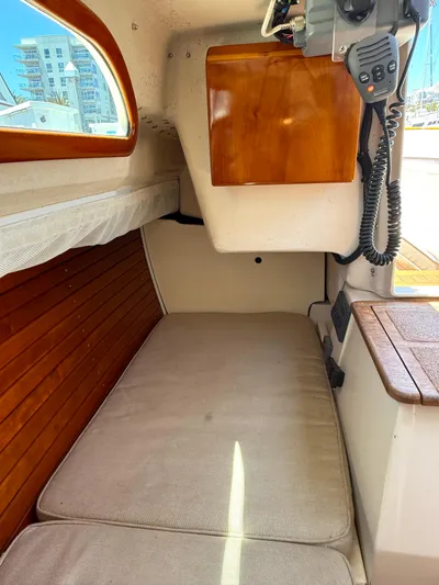 Bolero Yacht Photos Pics Interior of 2012 Morris M29 sailboat with wooden accents and cushioned seating.