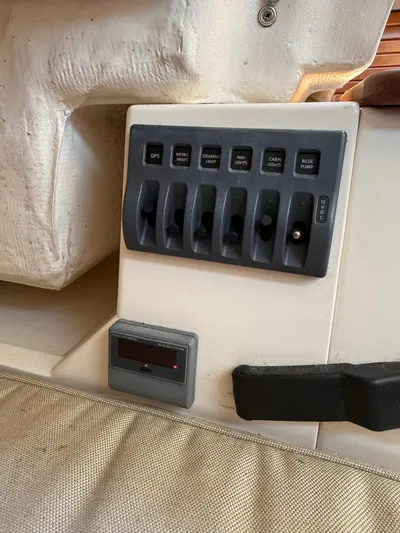 Bolero Yacht Photos Pics Control panel of a 2012 Morris M29 boat with labeled switches and a digital display.