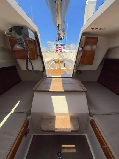 Bolero Yacht Photos Pics Interior view of 2012 Morris M29 sailboat, featuring seating and navigation equipment.